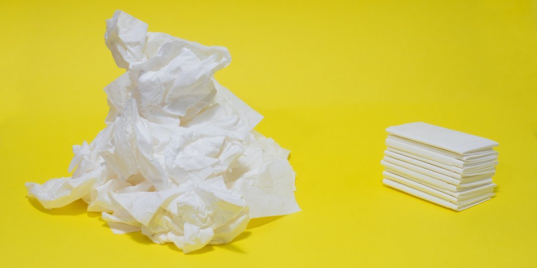Used and new tissues on yellow background. Concept of sickness, flu and cold, crying, untidy, masturbation.