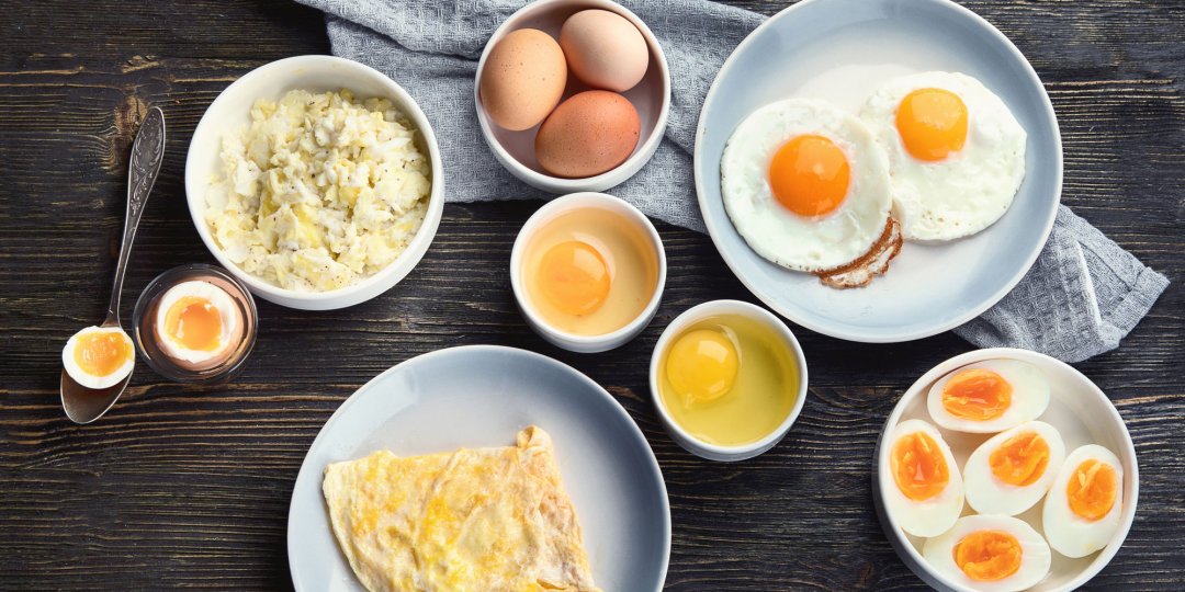 Different Ways to Cook Eggs on dark wooden background