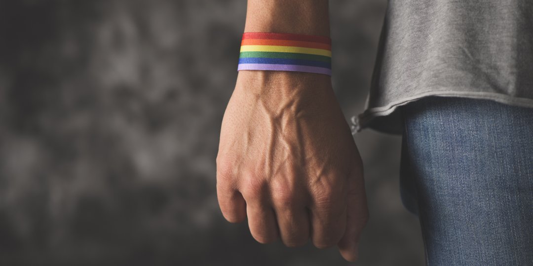 Man with Pride rainbow wrist band