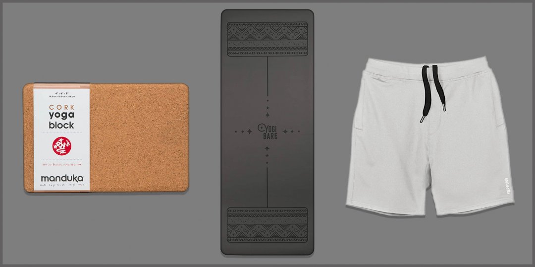 Yoga mat, shorts and block on grey background