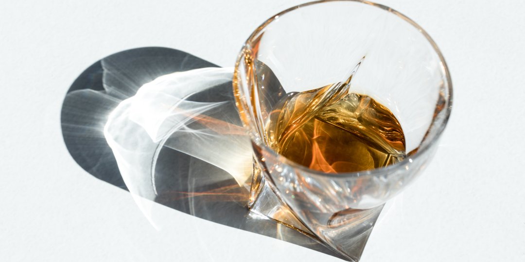 Whiskey glass on white background