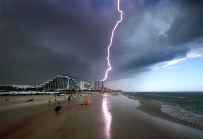 At least two people were struck by lightning in New Smyrna Beach on Tuesday. In this file photo, lightning strikes over Daytona Beach.
