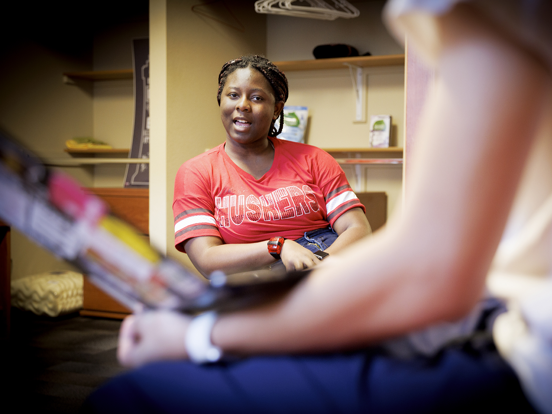 A student chats with her roommate while studying in in their room in the residence hall. [Craig Chandler